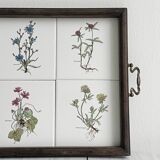 Old wooden plateau with floral tiles