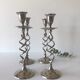 Four twisted silver candlesticks