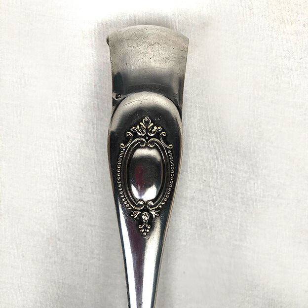 Set of three silver metal service cutlery