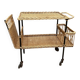 Vintage 1950s rolling dessert trolley in wicker and black tubing.