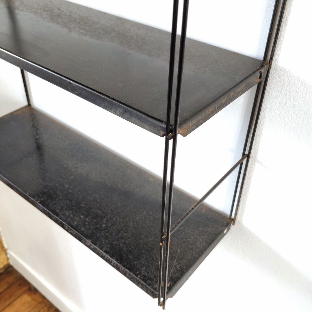 Patinated metal wall shelf