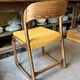 Chaise Baumann modèle "Traîneau" en bois foncé et coton ocre
