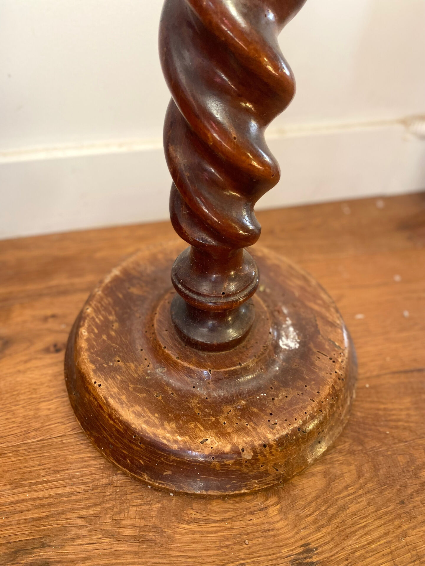 Antique pedestal table with a twisted column.