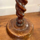 Antique pedestal table with a twisted column.