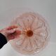 Pink pressed glass cake stand