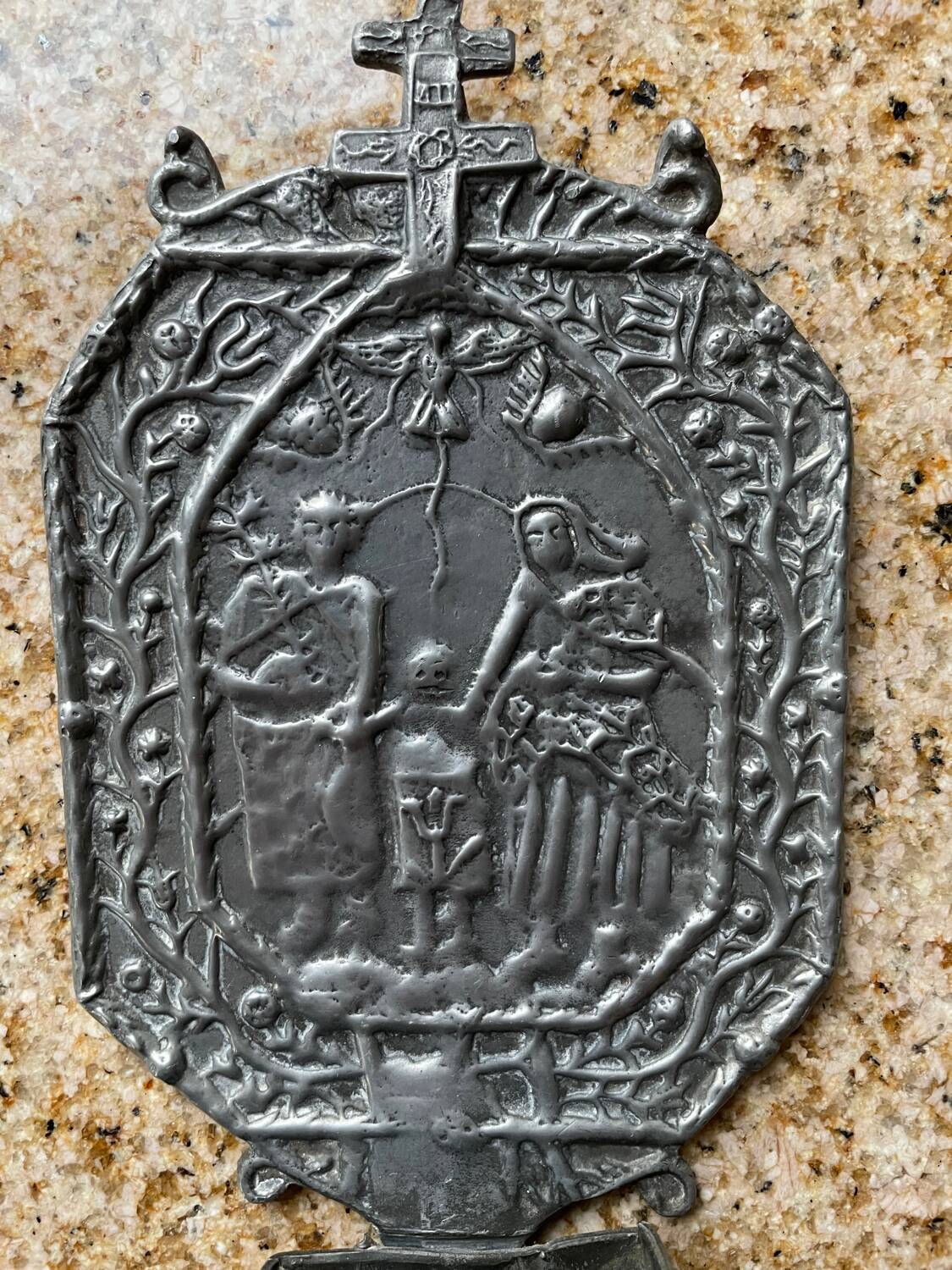 Small wall-mounted holy water font