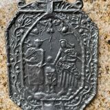 Small wall-mounted holy water font