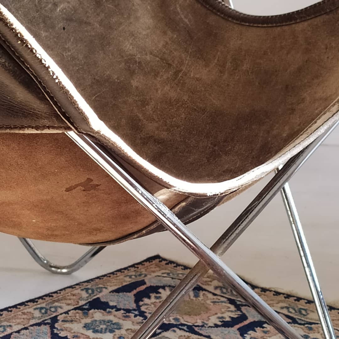AA Butterfly leather armchairs