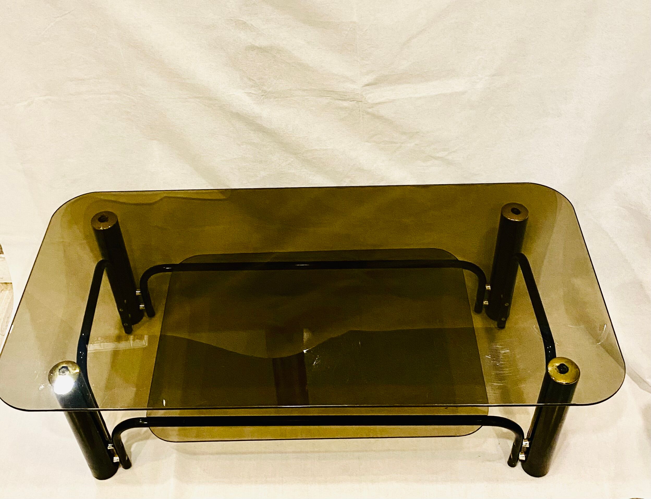 Black and gold coffee table with double tops in smoked glass circa 1970