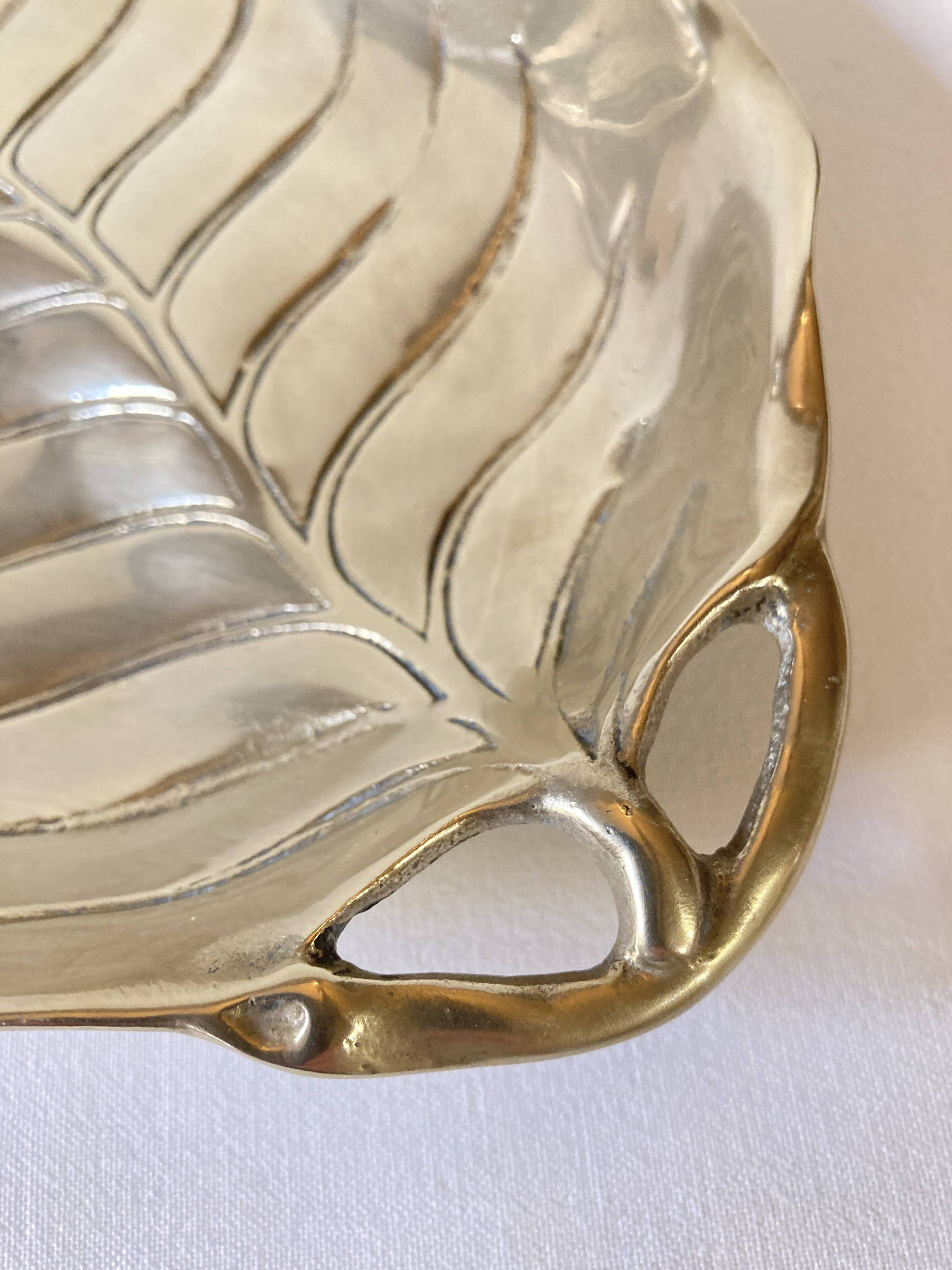 Brass pocket emptier