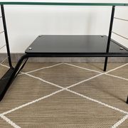 Metal and glass coffee table with magazine rack by Roche Bobois from the 1950s.
