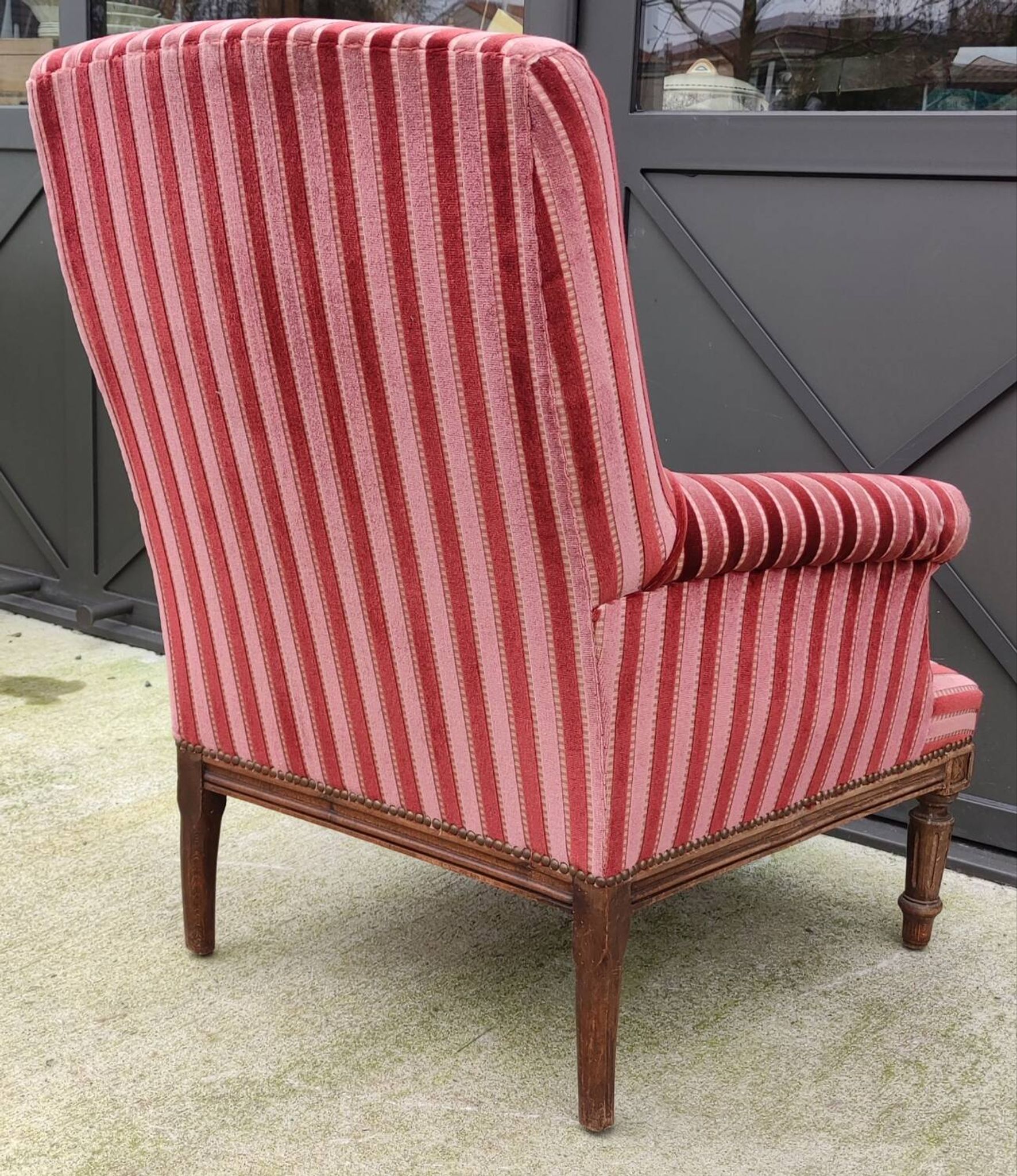 Old armchair and its Louis XVI style footrest/velvet covering