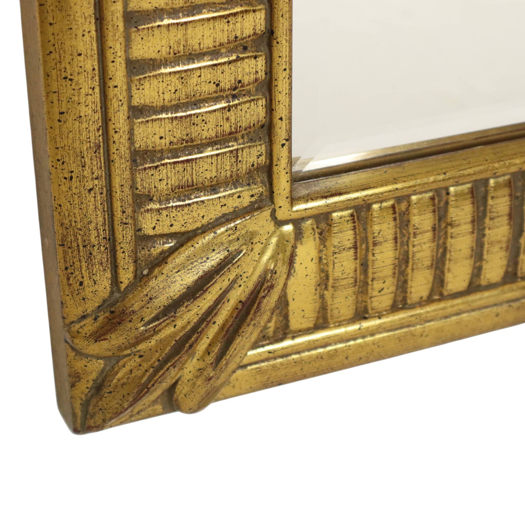 Miroir Deknudt en or Hollywood Regency biseauté 92 cm