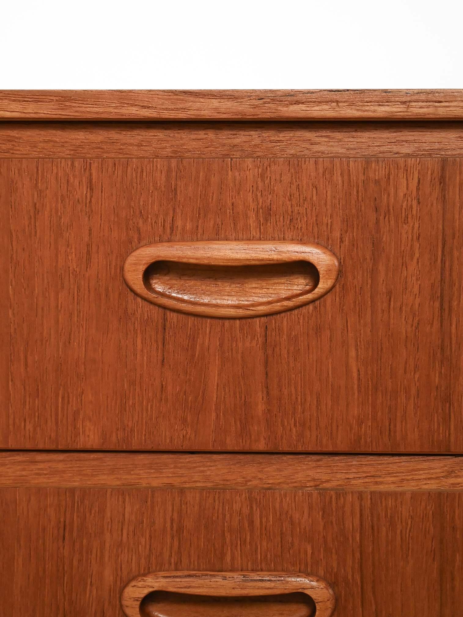 Scandinavian Chest of Drawers in teak with turned birch legs, 1950s