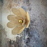Flower wall light made of rattan and raffia petals