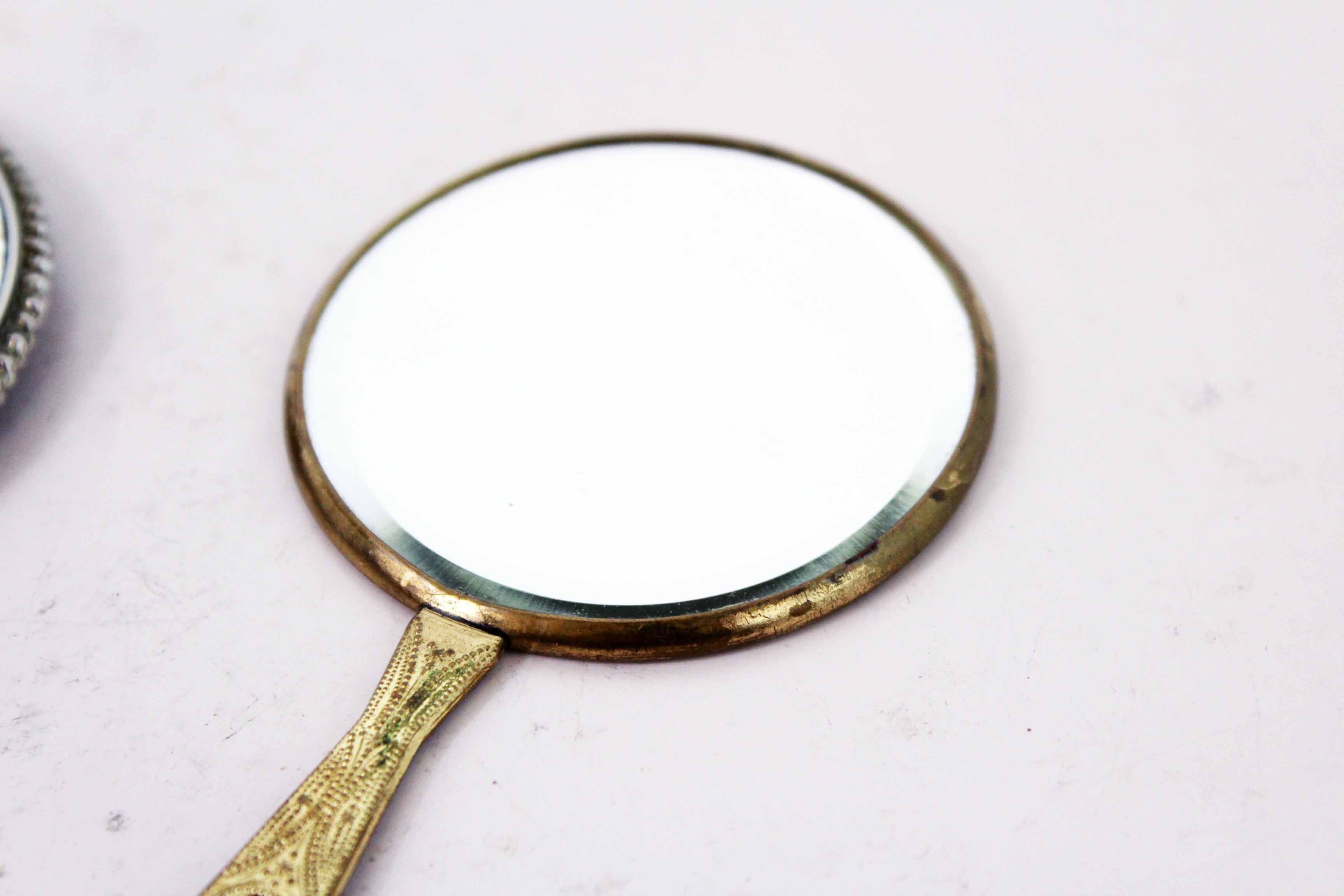 Old hand mirror duo