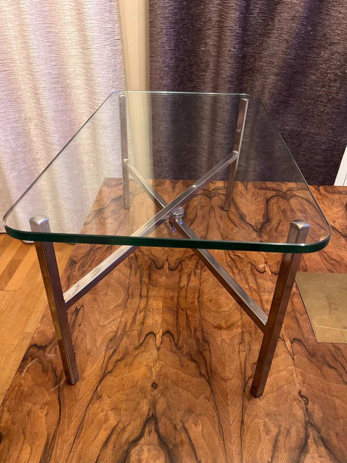 Small chrome and glass coffee table.