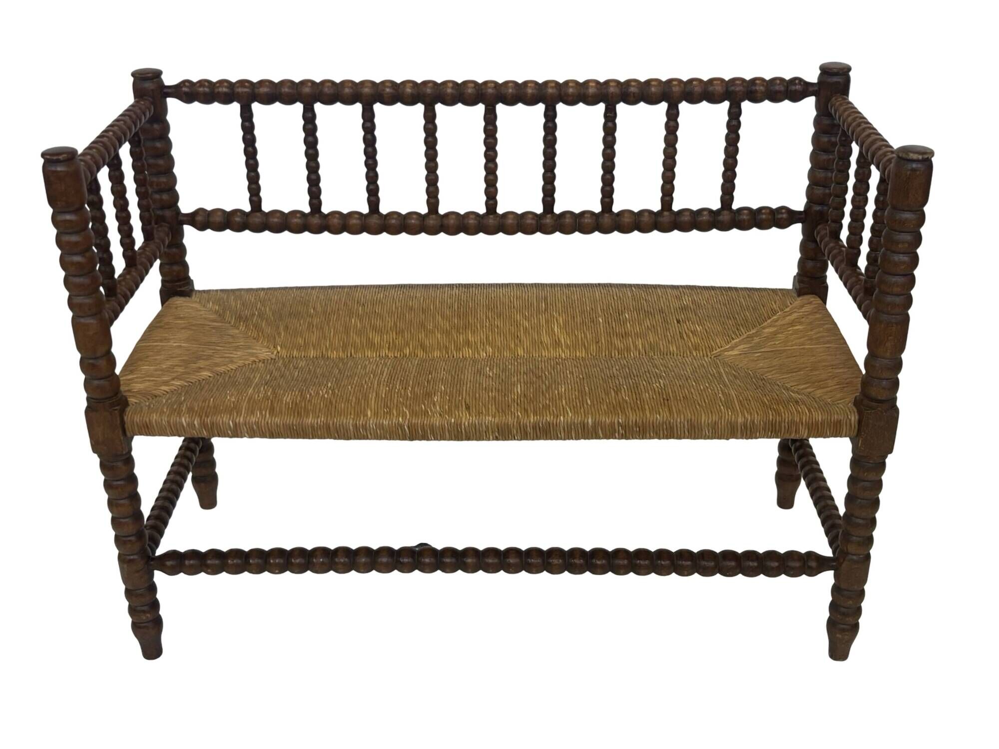 Vintage 'bobbin' bench with a rush seat, 1920s design with armrests.