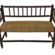 Vintage 'bobbin' bench with a rush seat, 1920s design with armrests.