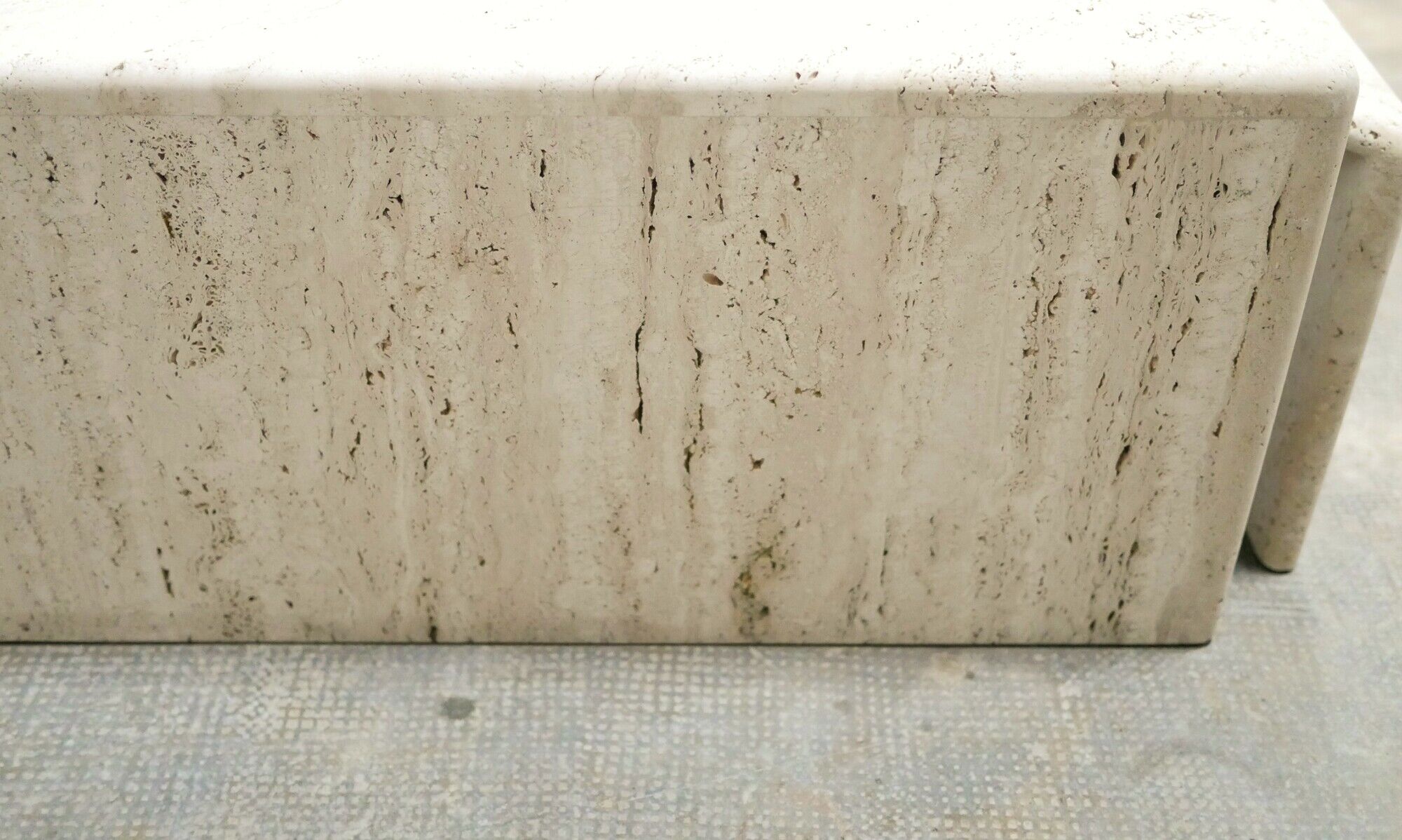 Series of 2 vintage travertine coffee tables published by Roche Bobois
