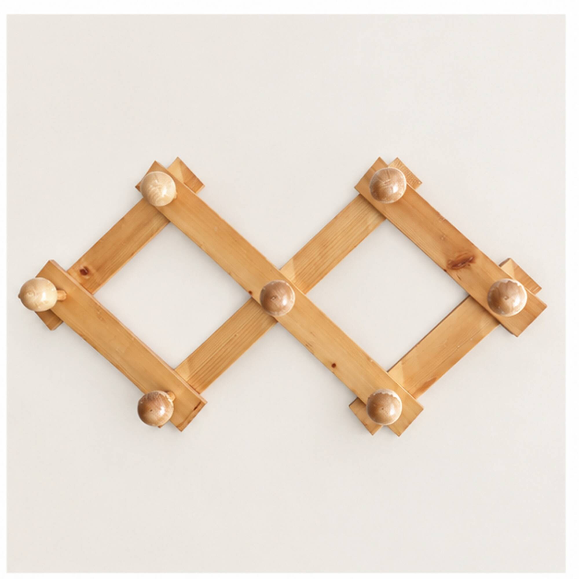 Extendable wall coat rack in light wood, 1980s.