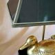 Lamp with brass duck on lacquered wood base