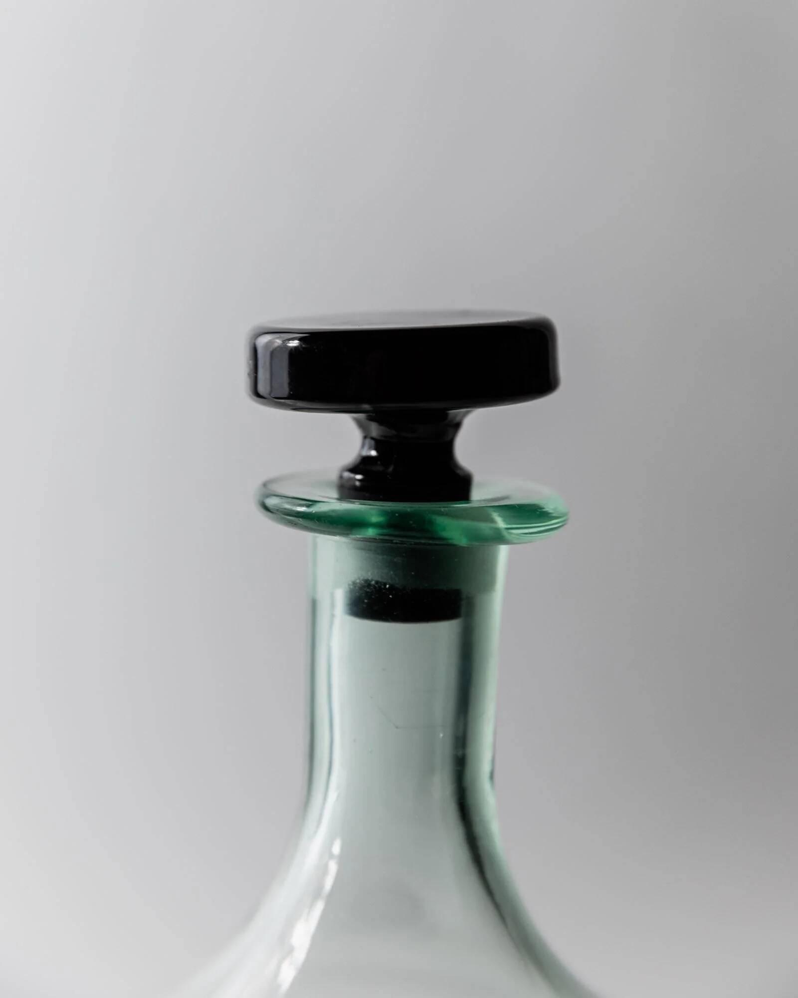 Vintage Murano glass carafe from the 1960s, green and black, with a stopper.