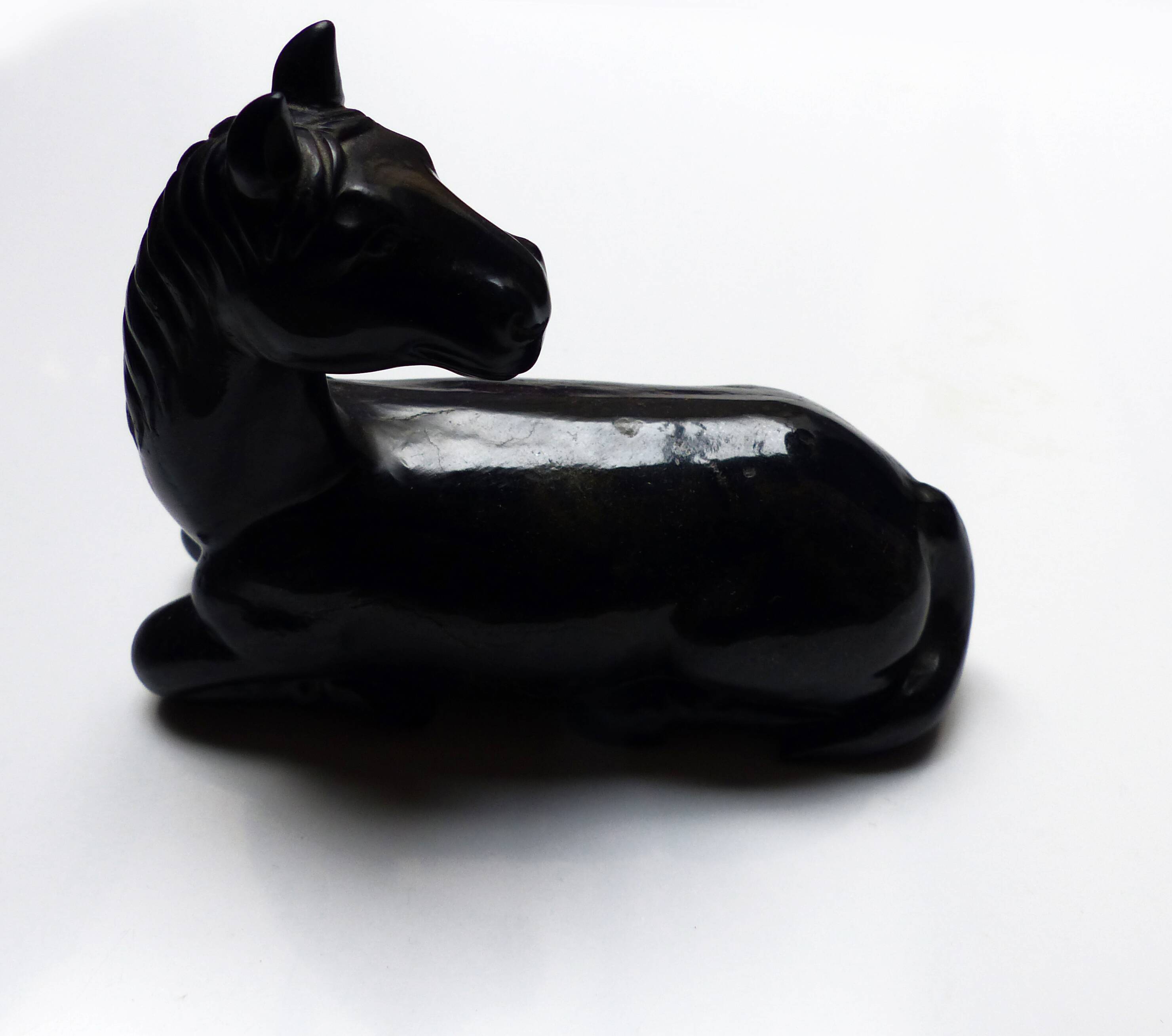 Black marble bookends with lying horses