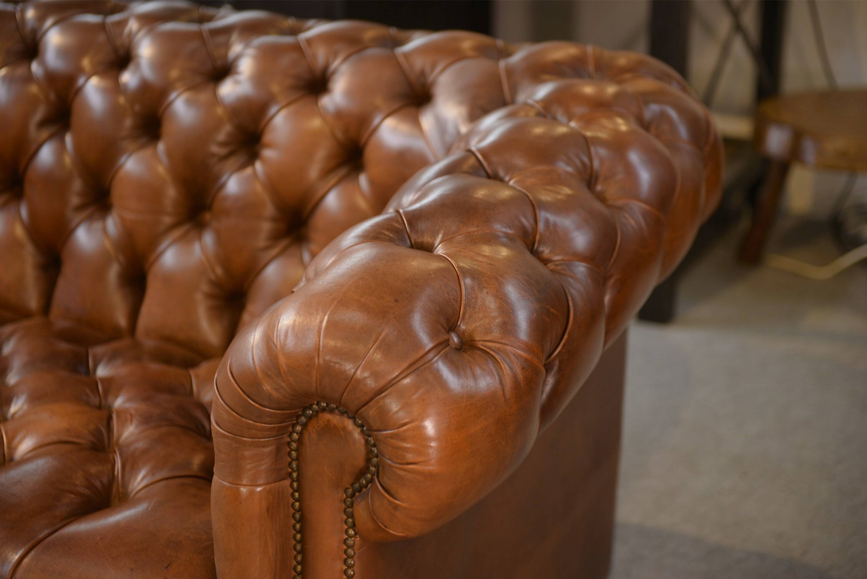 Tan leather tufted Chesterfield sofa