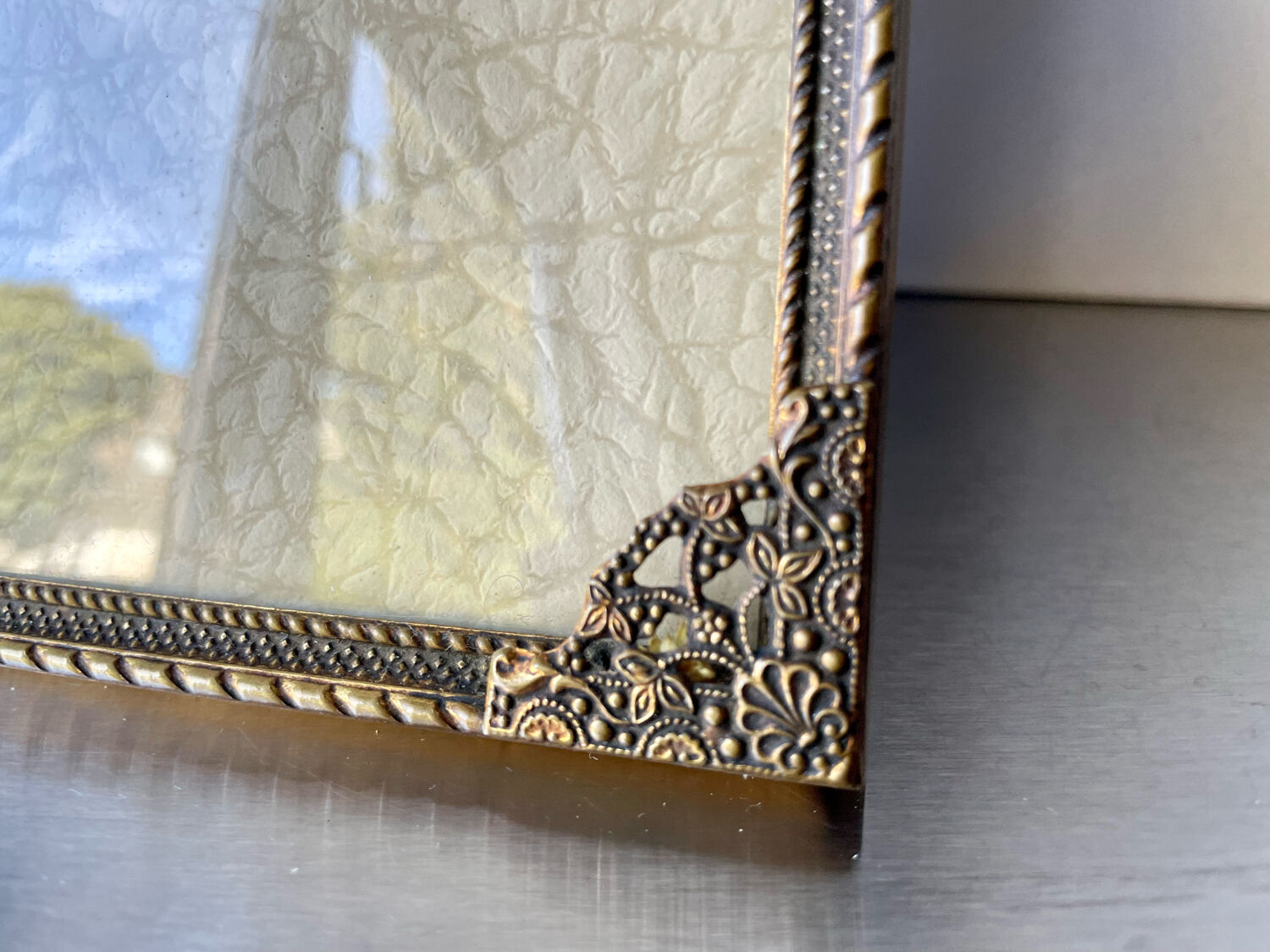 Metal frame in gold colored brass