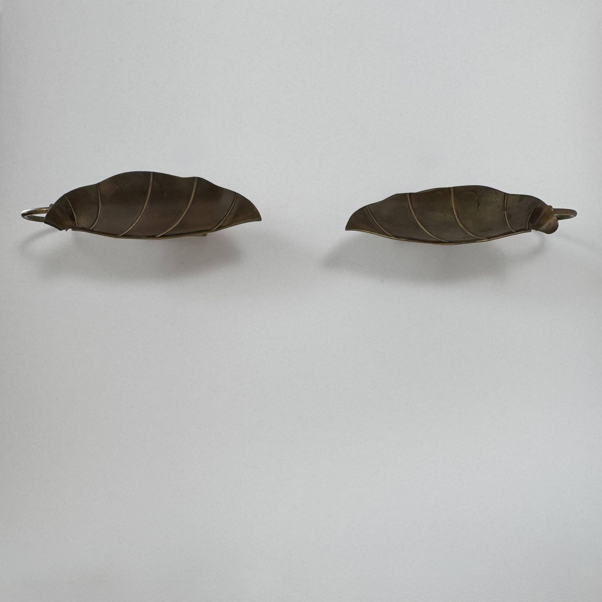 Pair of vintage wall lights, patinated brass, France, 1970.