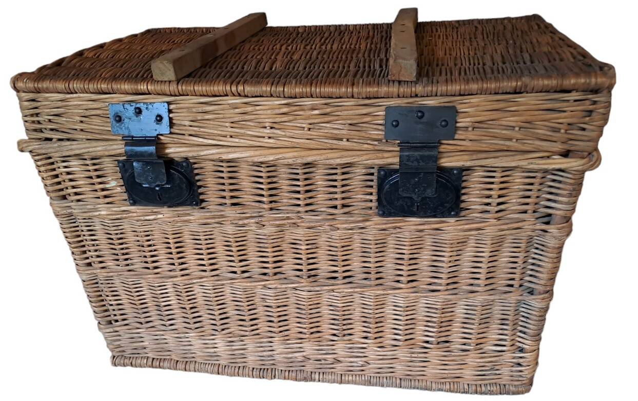 Wicker travel trunk XIX with metal clasps and handles.