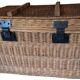 Wicker travel trunk XIX with metal clasps and handles.