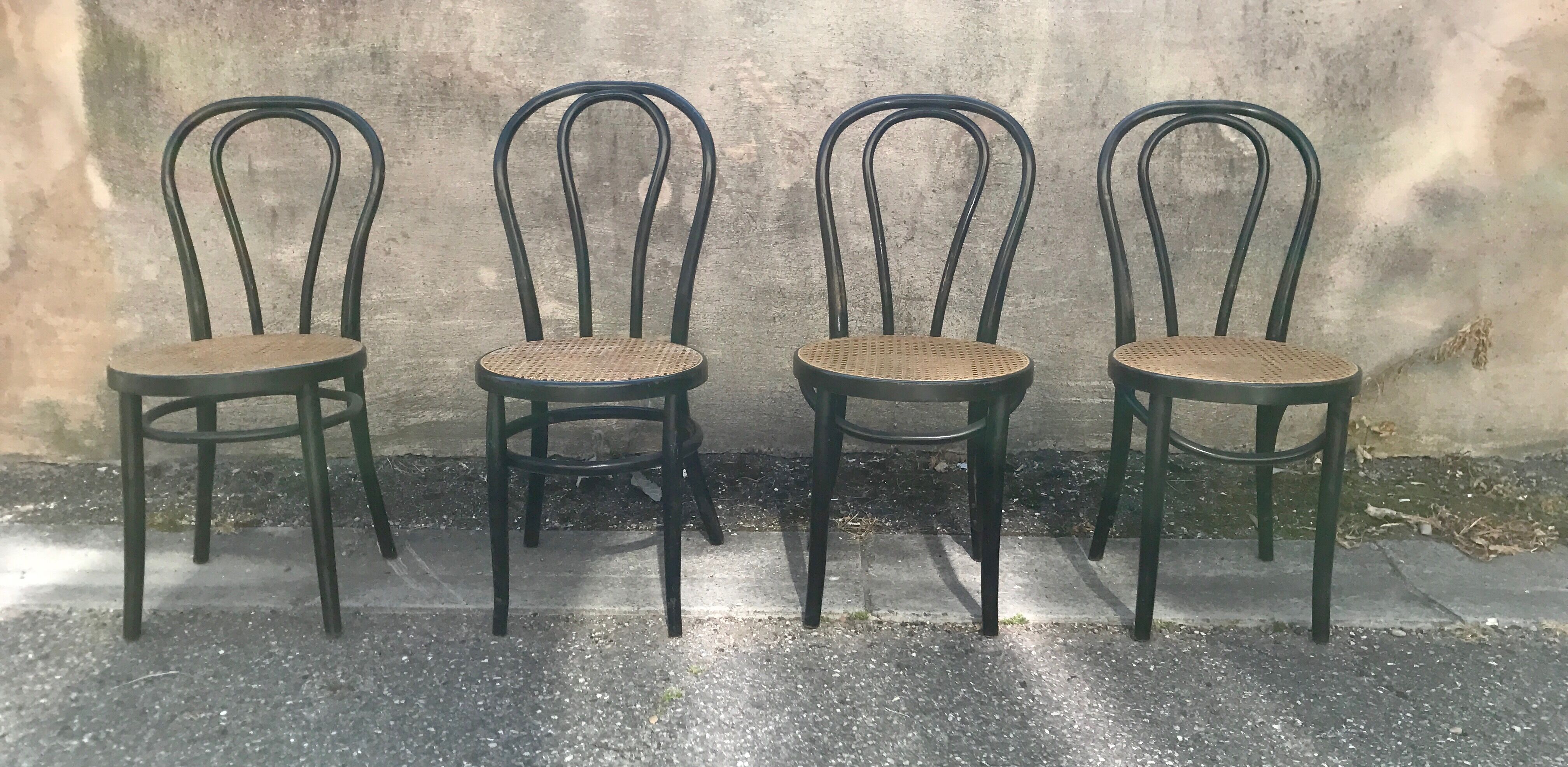 Two pairs of black 50s chairs - number 18 - cannée