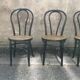 Two pairs of black 50s chairs - number 18 - cannée