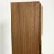 Narrow teak bookcase with two doors by Omann Jun, 1970s