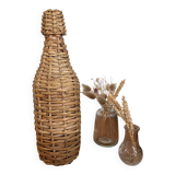 Bouteille en verre et rotin vintage