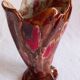 Ceramic vase, brown background, decorated with stylized tulips
