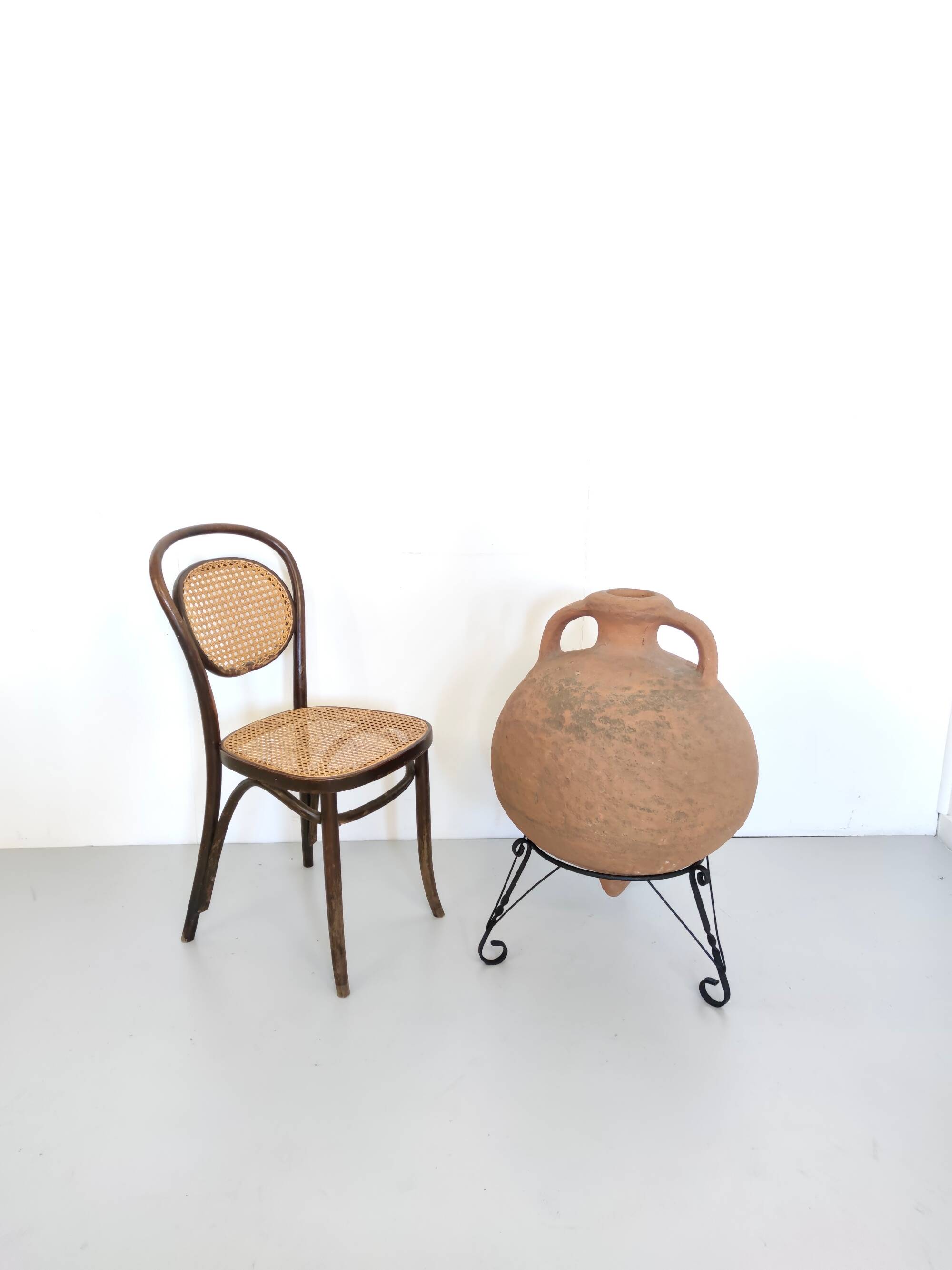 Hand-Modeled Earthenware Jar with a Black Varnished Iron Stand, Italy