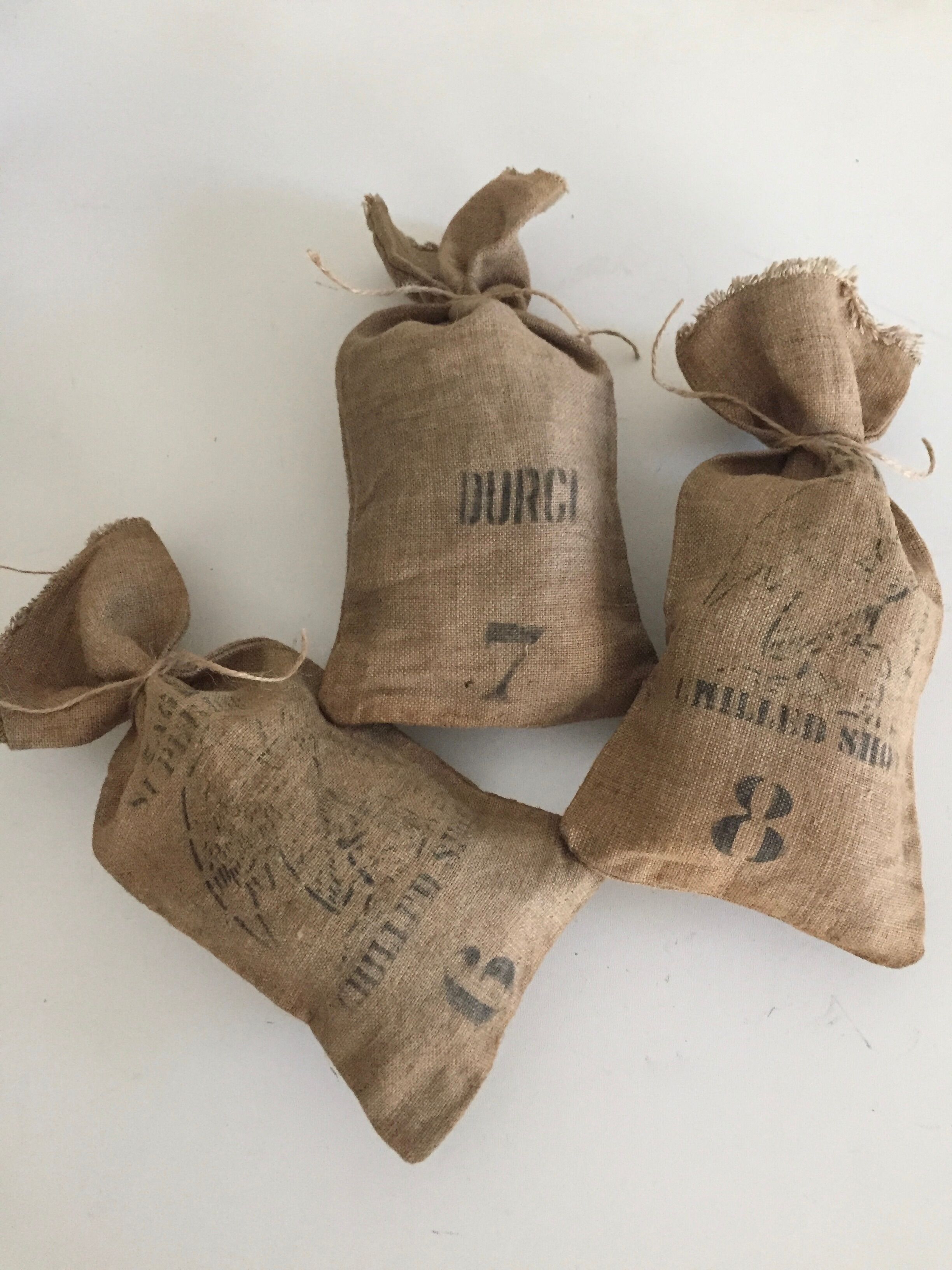 Set of three small jute bags, hardened lead