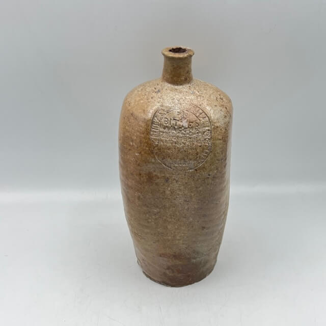 Engraved and square stoneware bottle
