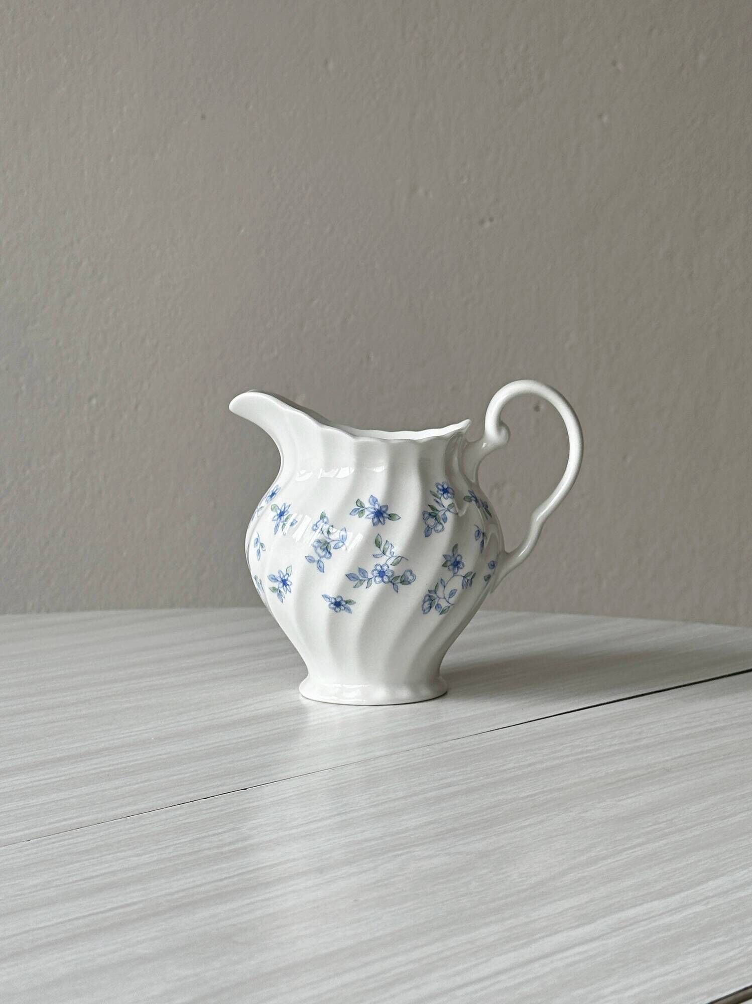 White porcelain creamer with small blue flowers – Milk jug