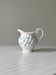 White porcelain creamer with small blue flowers – Milk jug
