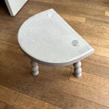 Small tripod stool in gray wood