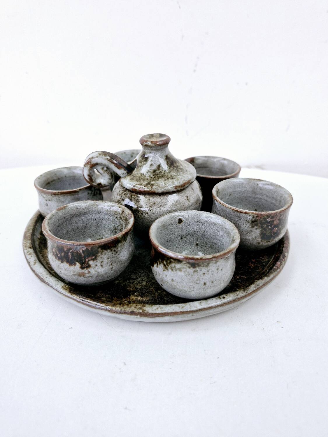 Vintage enameled stoneware service with 6 small bowls and a sugar bowl or sauce bowl