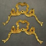 Pair of pediments with Louis XVI style knot in gilded bronze
