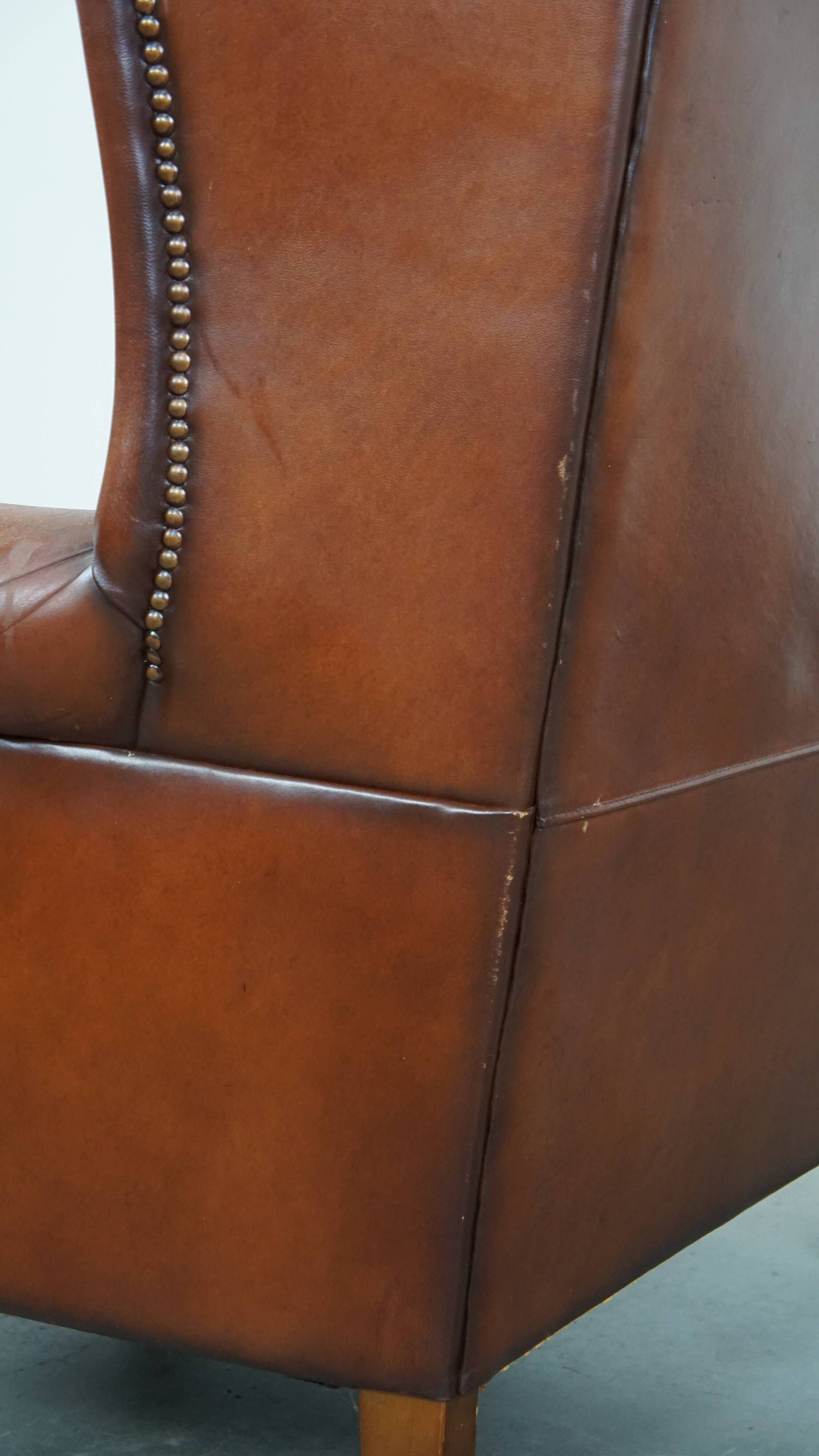 Sheepskin leather wingback chair with patina