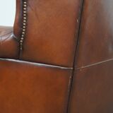 Sheepskin leather wingback chair with patina