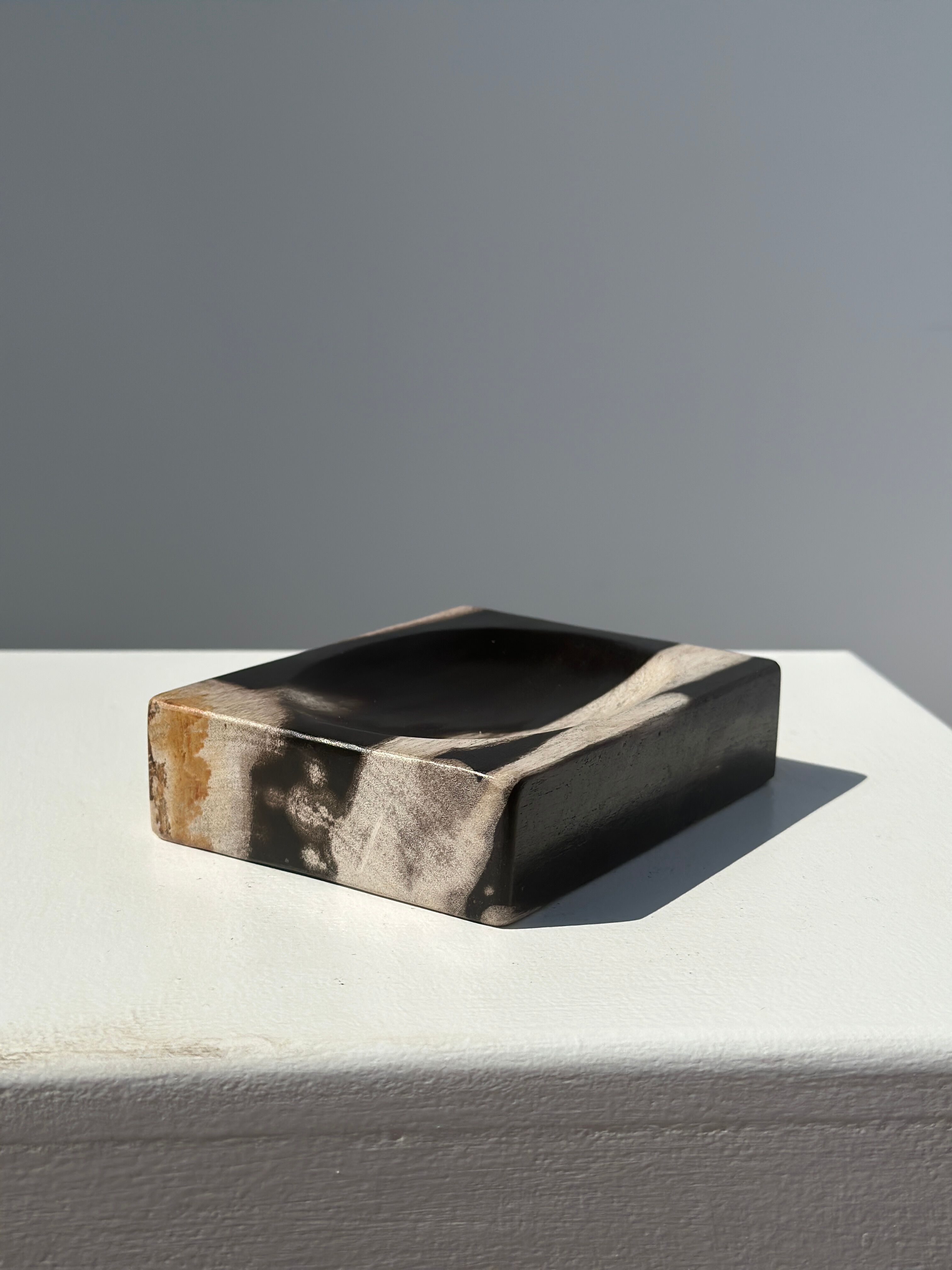 Symmetrical multicolored petrified wood soap dish