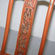 Antique Chinese folding chair with carvings, circa 1900-1920.